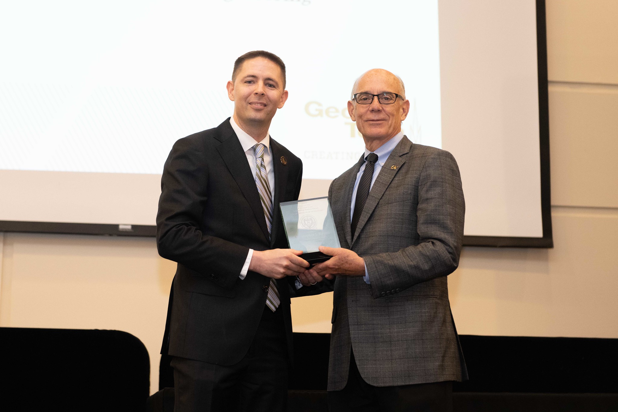 ECE Professor Chris Rozell (left) with Provost Rafael Bras